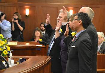 Representative Guttenberg (left) taking his oath of office along with Reps Wilson, Thompson and Kawasaki
