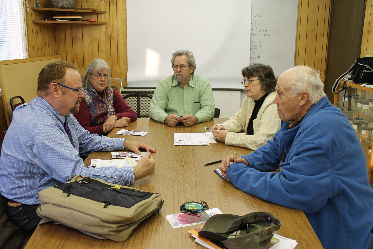 Rep Guttenberg speaks with Deputy Foster and local peony growers. picture credit Nancy Tarnai, UAF