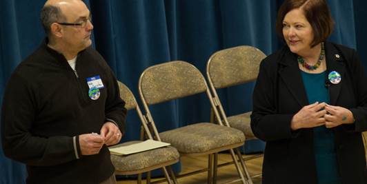 Senator Gardner and I enjoying listening to neighbors at our community meeting