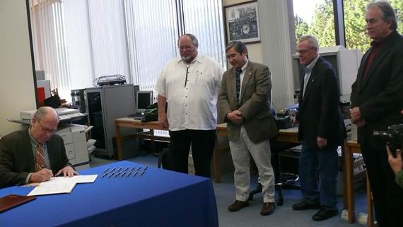 May 05, 2015: Governor Bill Walker signs SB 63, which names new State Library, Archive, and Museum in honor of Father Andrew Kashevaroff and Representative Richard Foster.