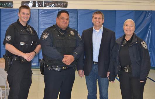 Rep. Chris Tuck is joined by members of the Anchorage Police Department at Willow Crest Elementary during his most recent community crime summit.