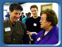Rep. Ethan Berkowitz, staffer Casey Fenton and a constituent amidst discussion.