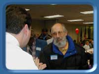 Rep. Eric Croft and a constituent at the food serving table.