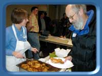 Rep. Gretchen Guess in fried chicken dispensing role.
