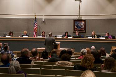 Rep. Claman listens to public testimony at the Anchorage Caucus Public Hearing last Saturday.