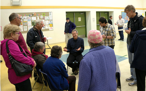 Rep. Claman talking with a circle of West Anchorage neighbors.