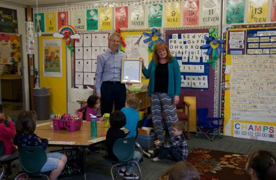 Sarah Afoa is presented with her legislative citation.