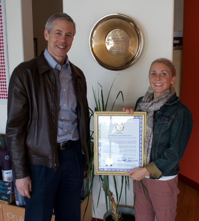 Rep. Claman presents Katey Inman with a legislative citation.