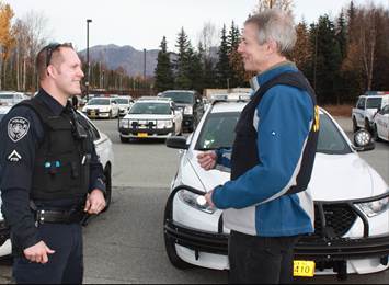 Rep. Claman with Officer Ranger before his police ride along last Friday.