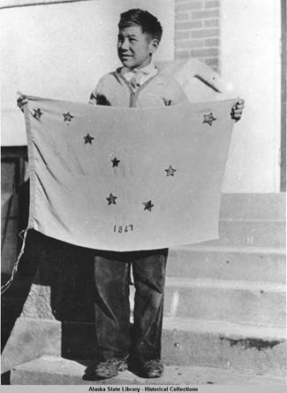 Benny Benson holding his Alaska Flag design.