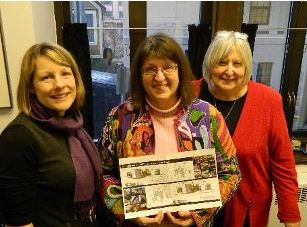 Harriet with Clare Ross and Mary Rasmussen, showing off the new  Z. J. Loussac renovation plans