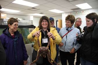 Learning about red king crab with Representatives LeDoux and Herron at the Norton Sound Seafood Products processing facility in Nome