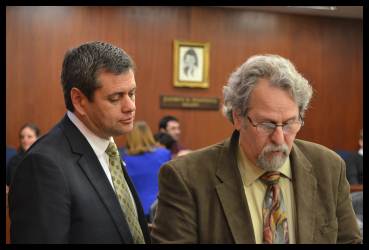 Minority Leader Rep. Chris Tuck (D-Anchorage) and Rep. David Guttenberg go over Operating Budget Amendments during a House Floor Session.