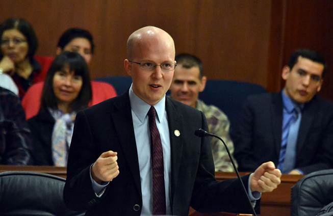 As supporters look on, Representative Jonathan Kreiss-Tomkins delivers closing remarks on the importance of Alaska Native languages on the floor of the Alaska state House of Representatives today, April 16, 2014.