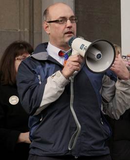Pumping up the crowd at a rally to support public education