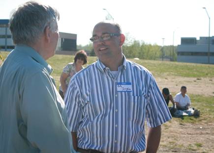 Catching up with a neighbor at the Cuddy Park picnic