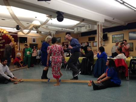 Rep. Josephson and Rep. Muoz share a dance at the Filipino Community, Inc Inaugural Ceremony