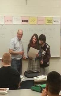 Presenting citations to the East High students that helped write them.
