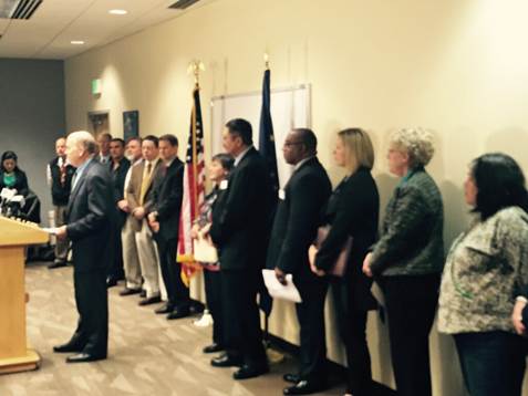 Gov. Walker makes his Medicaid announcement surrounded by his cabinet and supporters.