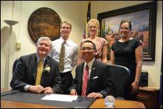 Rep. kawasaki signing the oath of office