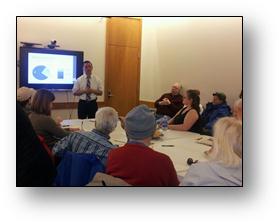 Rep. Kawasaki presents materials to a group of senior citizens