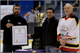 Rob Profitt, GM for the Ice Dogs, accepts a citation from Reps Kawasaki and Thompson for their 2011 NAHL West Championship Title.