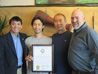 Rep. Wool and I presenting a citation honoring Fairbanks Thai Restaurants at Lemongrass. 
