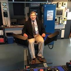Rep. Kito tries out the captain’s chair on the R/V Sikuliaq during a tour of the vessel while it was in Juneau.
