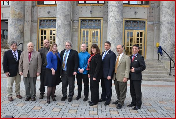 Sam stands with members of the House Democratic Caucus during a short break in the last days of session.