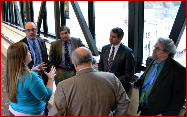 Sam with fellow members of House Democratic Caucus as they discuss amendments to HB 138 Gas Pipeline bill during an at ease.