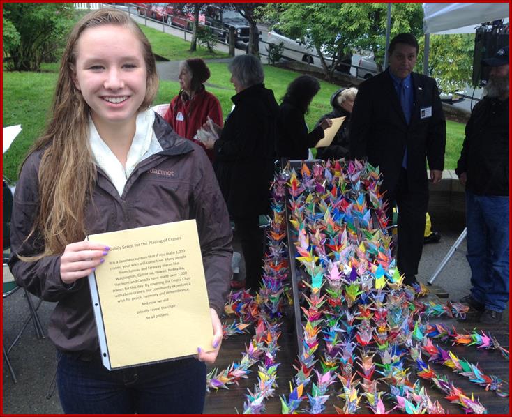 Gabi Kito (Sam’s daughter) describing the draping of cranes for the unveiling of the Empty Chair Project.