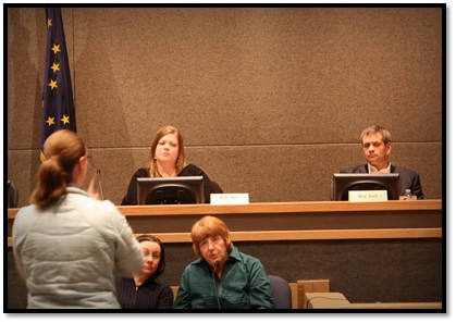 Representative Geran Tarr and Representative Chris Tuck listening intently to public testimony at the recent Anchorage Caucus