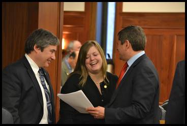 Newly Appointed Rep. Sam Kito III, Rep. Geran Tarr, and House Democratic Leader Rep. Chris Tuck discussing legislation on the House Floor.