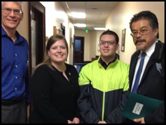Visitors from the Traumatic Brain Injury Network visiting with Rep. Tarr in Juneau while advocating for services.