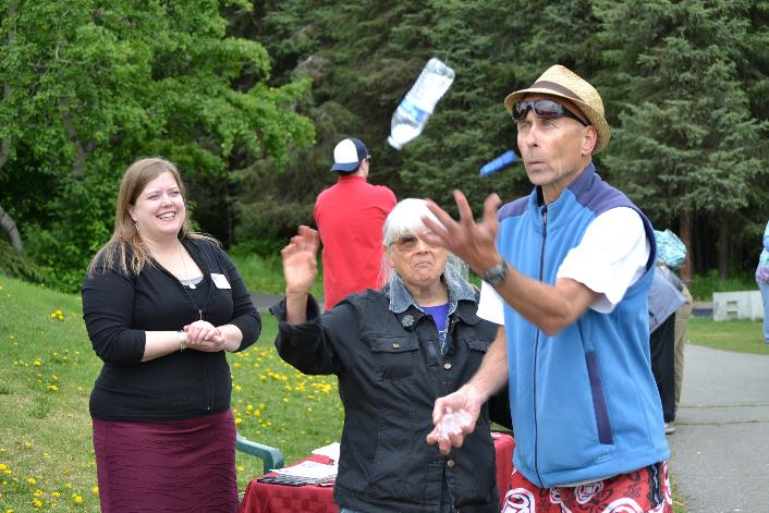 Rep. Tarr watches a juggler at the Airport Heights Community Picnic