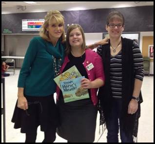 Julie Cook and Rep. Tarr present Ms. Cook’s books Straight from the Horse’s Mouth and The Kid Trapper. Both books are written to help children with the struggles they might encounter in their lives, such as not being believed when reporting child sexual abuse.