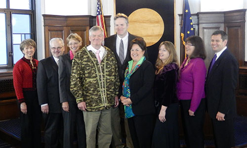 Rep. Tuck (far right) joins other former school board members from around the state for a group photo in the Speakers Chambers.