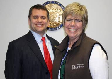 Rep. Chris Tuck and constituent Judy Olson connect up in Juneau.