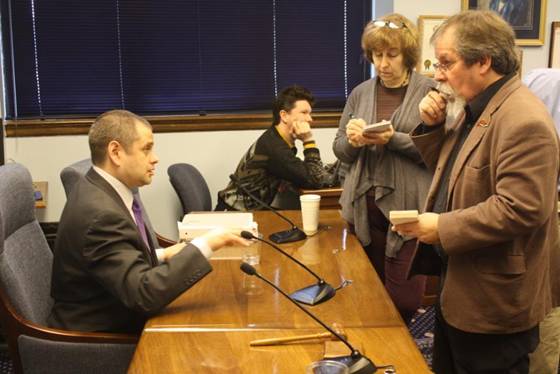 Rep. Chris Tuck meets with reporters after a morning press availability.