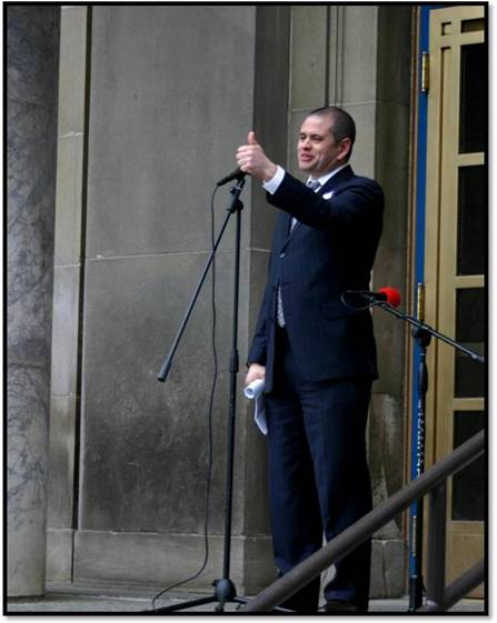 Representative Chris Tuck gives Alaskan working men and women a thumbs up for their achievements in growing our great state.