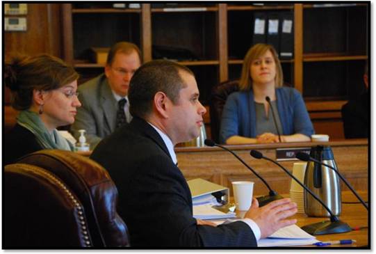 Representative Chris Tuck presents his Parents As Teachers Act (HB 49) to the House Finance Committee.