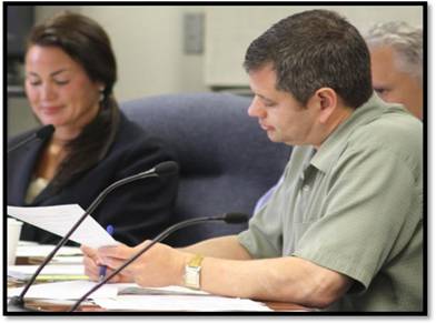 Representatives Chris Tuck and Kyle Johansen (R-Ketchikan) and Senator Lesil McGuire (R-Anchorage) take notes as Colleen Starring from Enstar speaks about how efforts to create Cook Inlet gas storage solutions are succeeding.