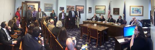 Rep. Chris Tuck chairing a public meeting of the Alaska Independent Democratic Coalition to review the agenda before the first legislative session of the year.