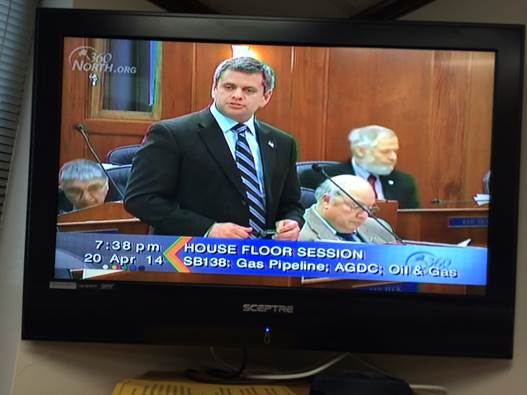 Above: Rep. Chris Tuck can be seen on television as he engages in floor debate during the last Legislative Session.
