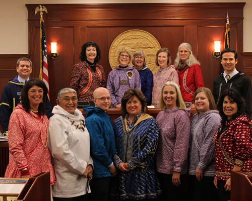 Representative Chris Tuck, far left, honors the legislative custom of ?Kuspuk Fridays,? in which members wear the traditional Native Kuspuk.