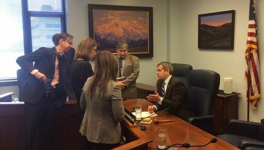 Rep. Chris Tuck responds to questions from members of the press.