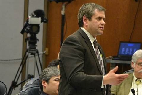 Rep. Tuck speaks in support of limiting probation and parole officers caseloads on the temporary House Floor located in the gymnasium at the Terry Miller Legislative Office Building, which has a gym because it was originally built as Juneau High School and later housed elementary students as Capital School.