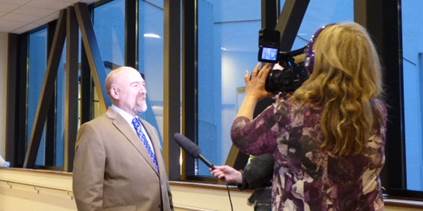 Talking to reporter Dorene Lorenz about my bill to reform health insurance rate review.